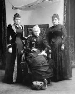 Black and white photo of Sarah standing alongside Emily S. Richards and Phoebe Beattie--two more of Utah's influential women.