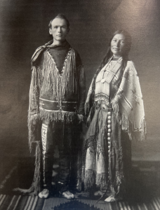 White man and Sioux woman wearing Native American clothing