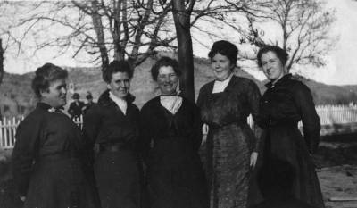 Black and white image of the Kanab Town Council smiling. L to R: Mary W. Chamberlain, Blanche Hamblin, Tamar Hamblin, Luella McAllister, and Ada Seegmiller.