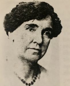 Photograph of a woman with necklace.