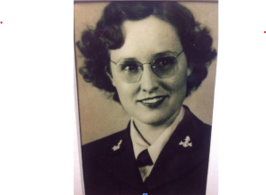Image of a woman wearing Navy uniform and glasses.